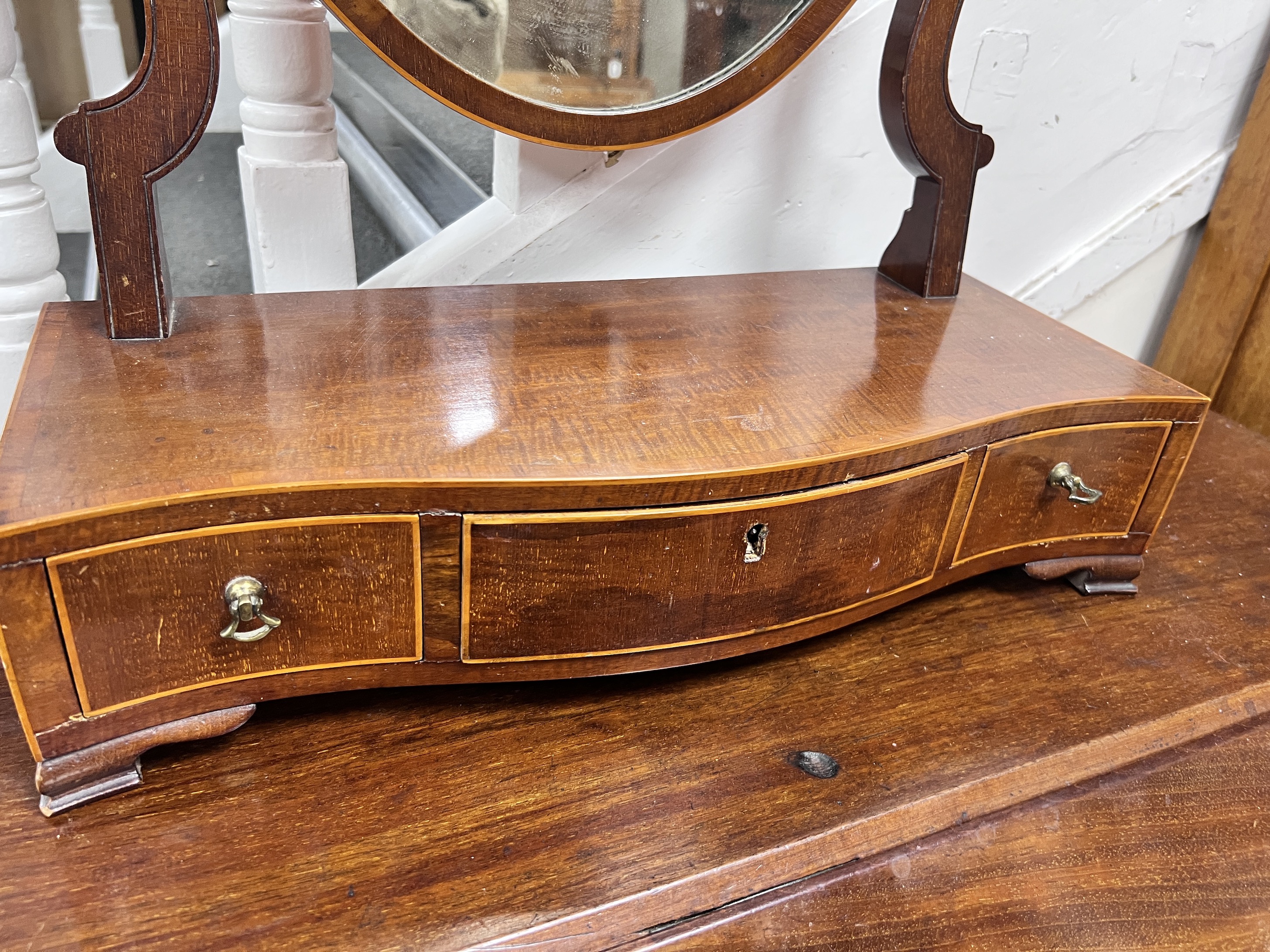 A Sheraton style strung mahogany toilet mirror, width 48cm, height 62cm